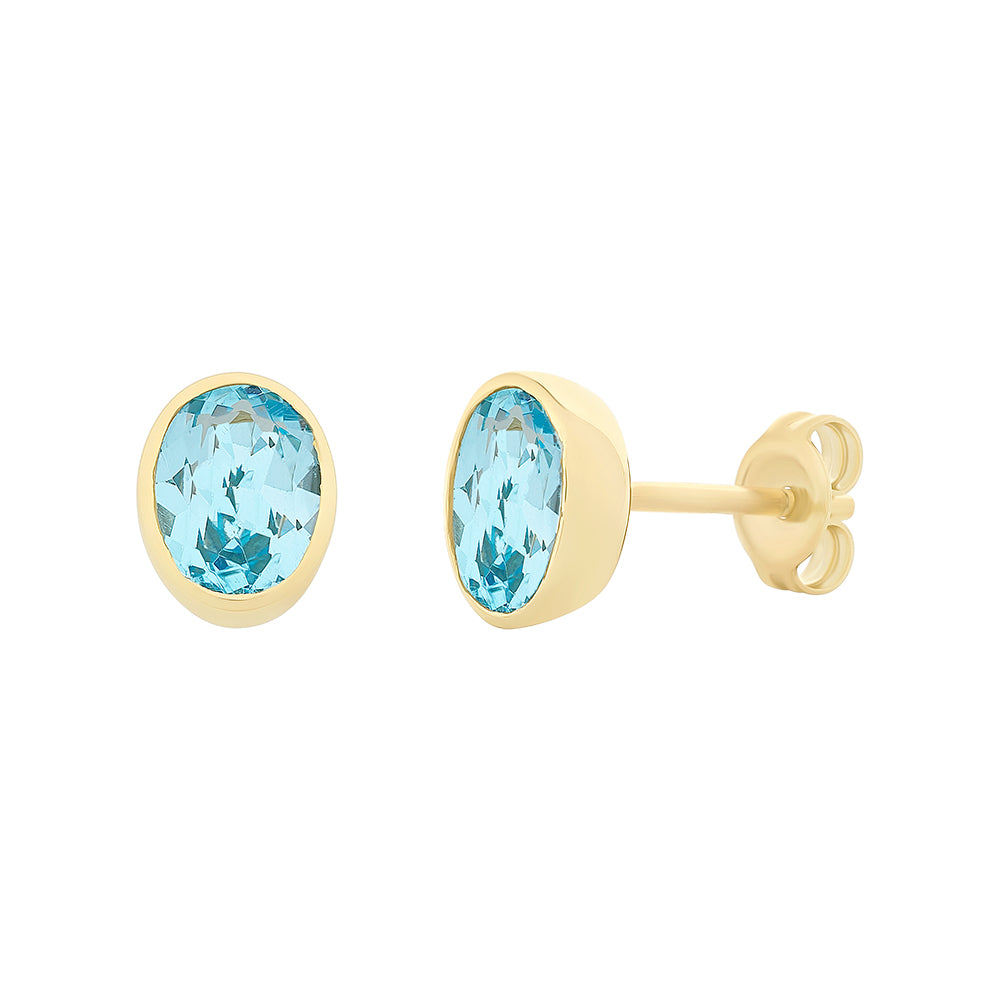 9Ct Yellow Gold Oval Bezel Set Blue Topaz Studs