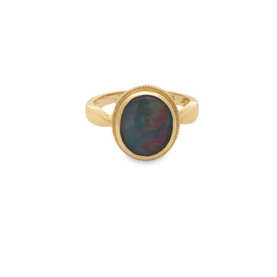 9Ct Yellow Gold Oval Red/Blue/Green 12Mm X 10Mm Triplet Opal Bezel Set Ring. With Outer Edge And Milgrain Detail Size Q