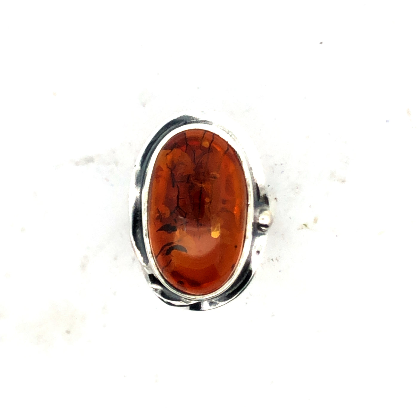 Sterling Silver Bezel Set Amber Ring With Decorative Outer Edge