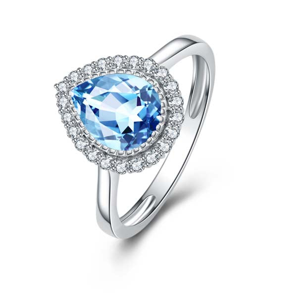 9Ct White Gold Pear Shaped Blue Topaz And Diamond Halo Ring.